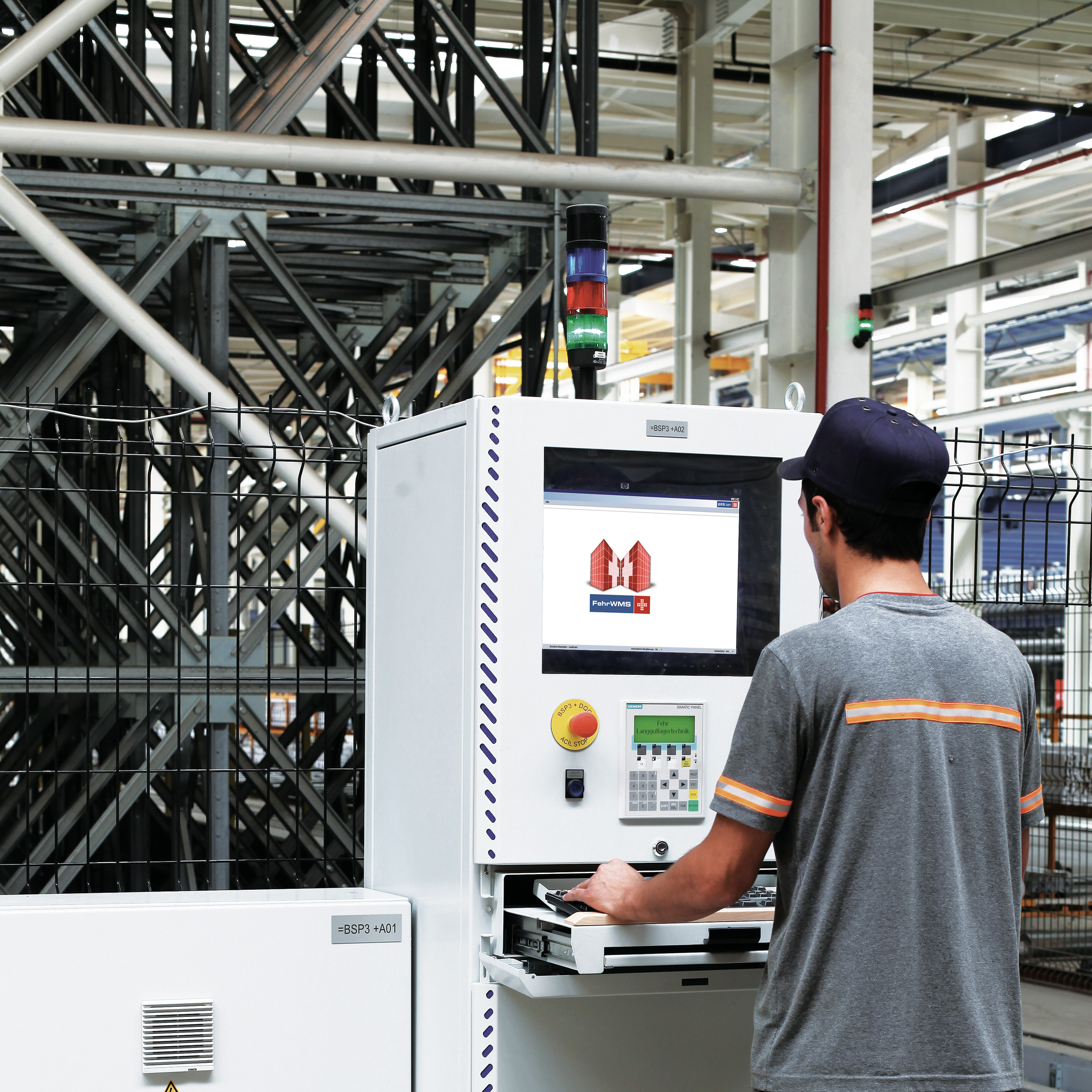 Photo of a production employee using Fehr WMS warehouse management software